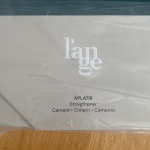 Tourmaline infused ceramic straightener. New in packaging.